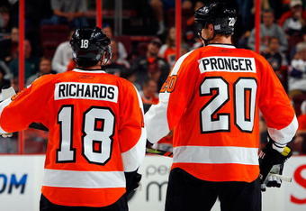 PHILADELPHIA - OCTOBER 22:  Chris Pronger #20 of the Philadelphia Flyers talks with teammate Mike Richards #18 during a time out against the Boston Bruins on October 22, 2009 at Wachovia Center in Philadelphia, Pennsylvania. The Flyers won the game 4-3 after a shootout.  (Photo by Jim McIsaac/Getty Images)