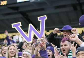 SEATTLE - NOVEMBER 28: Washington Huskies fans cheer during the game against the Washington State Cougars on November 28, 2009 at Husky Stadium in Seattle, Washington. The Huskies defeated the Cougars 30-0. (Photo by Otto Greule Jr/Getty Images)