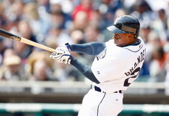 DETROIT - APRIL 10:  Curtis Granderson #28 of the Detroit Tigers swings at the pitch against the Texas Rangers during Opening Day on April 10, 2009 at Comerica Park in Detroit, Michigan. Detroit won the game 15-2. (Photo by Gregory Shamus/Getty Images)