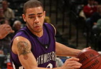 INDIANAPOLIS - MARCH 12:  Michael Thompson #22 of the Northwestern Wildcats drives against the Minnesota Golden Gophers during the first round of the Big Ten Men's Basketball Tournament at Conseco Fieldhouse on March 12, 2009 in Indianapolis, Indiana.  (Photo by Jonathan Daniel/Getty Images)