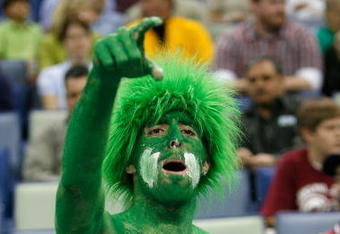 NEW ORLEANS - MARCH 16:  A fan of the North Texas Mean Green cheers for the team over the Memphis Tigers during round one of the NCAA Men's Basketball Tournament at the New Orleans Arena on March 16, 2007 in New Orleans, Louisiana.  (Photo by Chris Graythen/Getty Images)