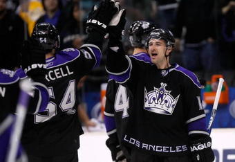 LOS ANGELES, CA - DECEMBER 07:  Justin Williams #14 of the Los Angeles Kings congratulates teammate Teddy Purcell #54 following the the Kings' 2-1 victory over the Calgary Flames at Staples Center on December 7, 2009 in Los Angeles, California.  (Photo by Jeff Gross/Getty Images)