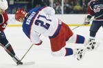 22 Feb 2002:  Alexei Kovalev #27 of Russia flies through the air as Doug Weight #39 of the USA takes control of the puck in the men's ice hockey semifinal during the Salt Lake City Winter Olympic Games at the E Center in Salt Lake City, Utah. USA defeated Russia 3-2, advancing to the gold medal match against Canada.  DIGITAL IMAGE. Mandatory Credit:   Jamie Squire/Getty Images