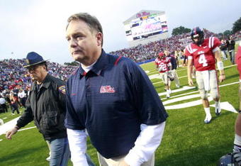 OXFORD, MS - OCTOBER 10:  Coach Houston Nutt of the Mississippi Rebels walks off the field followed by quarterback Jevan Snead #4 after losing to the Alabama Crimson Tide 22-3 in their college football game at Vaught-Hemingway Stadium on October 10, 2009 in Oxford, Mississippi. (Photo by Dave Martin/Getty Images)