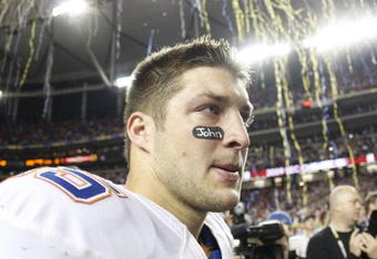 ATLANTA - DECEMBER 5:  Quarterback Tim Tebow #15 of the Florida Gators walks off the field as confetti falls after Florida lost 32-13 against the Alabama Crimson Tide during the SEC Championship game at Georgia Dome on December 5, 2009 in Atlanta, Georgia.  (Photo by Chris Graythen/Getty Images)