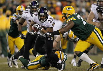 GREEN BAY, WI - DECEMBER 7:  Ray Rice #27 of the Baltimore Ravens runs the ball in the first half against Ryan Pickett #79 of the Green Bay Packers at Lambeau Field on December 7, 2009 in Green Bay, Wisconsin.  (Photo by Jonathan Daniel/Getty Images)