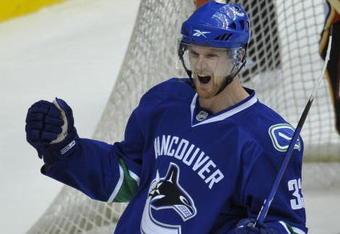 VANCOUVER, CANADA - APRIL 7: Henrik Sedin #33 of the Vancouver Canucks celebrates his goal during their game against Calgary Flames at General Motors Place April 7, 2009 in Vancouver, Canada.   (Photo by Nick Didlick/Getty Images)