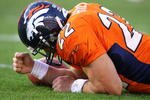 DENVER - DECEMBER 7: Fullback/running back Peyton Hillis #22 of the Denver Broncos pounds his fist against the turf as he lays injured against the Kansas City Chiefs during the second quarter of week 14 NFL action at Invesco Field at Mile High on December 7, 2008 in Denver, Colorado. Hillis left the game which left the Broncos with one healthy running back, Tatum Bell.(Photo by Marc Piscotty/Getty Images)