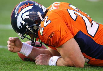 DENVER - DECEMBER 7: Fullback/running back Peyton Hillis #22 of the Denver Broncos pounds his fist against the turf as he lays injured against the Kansas City Chiefs during the second quarter of week 14 NFL action at Invesco Field at Mile High on December 7, 2008 in Denver, Colorado. Hillis left the game which left the Broncos with one healthy running back, Tatum Bell.(Photo by Marc Piscotty/Getty Images)