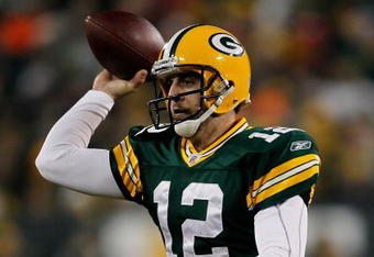 GREEN BAY, WI - DECEMBER 07: Aaron Rodgers #12 of the Green Bay Packers throws a pass against the Baltimore Ravens at Lambeau Field on December 7, 2009 in Green Bay, Wisconsin. The Packers defeated the Ravens 27-17. (Photo by Jonathan Daniel/Getty Images)