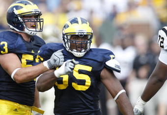 ANN ARBOR, MI - SEPTEMBER 5:  Brandon Graham #55 and Ryan Van Bergen #53 of the Michigan Wolverines celebrate a play during the game against the Western Michigan Broncos on September 5, 2009 at Michigan Stadium in Ann Arbor, Michigan. (Photo by Gregory Shamus/Getty Images) 