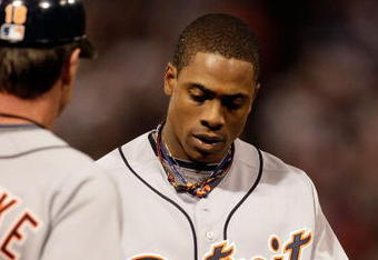 MINNEAPOLIS - OCTOBER 06:  Curtis Granderson #28 of the Detroit Tigers walks off the field after being stranded on base during the American League Tiebreaker game against the Minnesota Twins on October 6, 2009 at Hubert H. Humphrey Metrodome in Minneapolis, Minnesota.  (Photo by Jamie Squire/Getty Images)