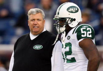 FOXBORO, MA - NOVEMBER 22:  Coach Rex Ryan of the New York Jets chats with David Harris #52 before a game against the New England Patriots at Gillette Stadium on November 22, 2009 in Foxboro, Massachusetts. (Photo by Jim Rogash/Getty Images)