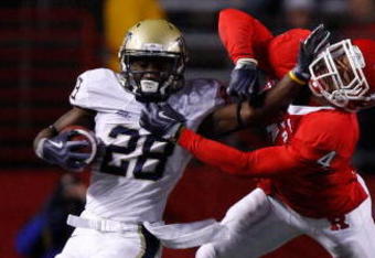 PISCATAWAY, NJ - OCTOBER 16: Dion Lewis #28 of the University of Pittsburgh Panthers stiff arms David Rowe #4 of the Rutgers University Scarlett Knights on October 16, 2009 at Rutgers Stadium in Piscataway, New Jersey. (Photo by Jared Wickerham/Getty Images)