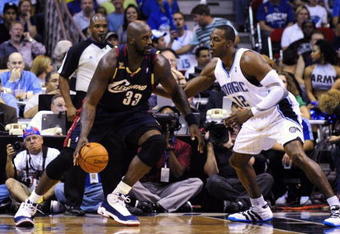 ORLANDO, FL - NOVEMBER 11:  Shaquille O'Neal #33 of the Cleveland Cavaliers looks to maneuver against Dwight Howard #12 of the Orlando Magic during the game on November 11, 2009 at Amway Arena in Orlando, Florida. NOTE TO USER: User expressly acknowledges and agrees that, by downloading and/or using this Photograph, user is consenting to the terms and conditions of the Getty Images License Agreement. (Photo by Sam Greenwood/Getty Images)