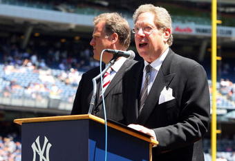 NEW YORK - JULY 19:  New York Yankees radio broadcaster John Sterling speaks during the teams 63rd Old Timers Day before the game against the Detroit Tigers on July 19, 2009 at Yankee Stadium in the Bronx borough of New York City.  (Photo by Jim McIsaac/Getty Images)