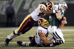 EAST RUTHERFORD, NJ - AUGUST 16:  Kellen Clemens #11 of the New York Jets  is sacked by Chris Horton #48 and Antwaan Randle El #82 of the Washington Redskins in a pre-season NFL game at Giants Stadium, August 16, 2008 in East Rutherford, New Jersey.  (Photo by Jeff Zelevansky/Getty Images)