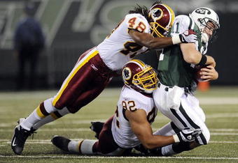 EAST RUTHERFORD, NJ - AUGUST 16:  Kellen Clemens #11 of the New York Jets  is sacked by Chris Horton #48 and Antwaan Randle El #82 of the Washington Redskins in a pre-season NFL game at Giants Stadium, August 16, 2008 in East Rutherford, New Jersey.  (Photo by Jeff Zelevansky/Getty Images)