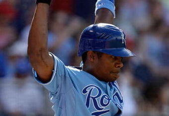 KANSAS CITY, MO - JUNE 20:  Jose Guillen #11 of the Kansas City Royals waits to bat against the St. Louis Cardinals during the game on June 20, 2009 at Kauffman Stadium in Kansas City, Missouri. (Photo by Jamie Squire/Getty Images)