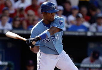 KANSAS CITY, MO - JUNE 20:  Jose Guillen #11 of the Kansas City Royals bats against the St. Louis Cardinals during the game on June 20, 2009 at Kauffman Stadium in Kansas City, Missouri. (Photo by Jamie Squire/Getty Images)