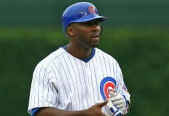 CHICAGO - AUGUST 28: Milton Bradley #21 of the Chicago Cubs stands on second base after hitting a double against the New York Mets on August 28, 2009 at Wrigley Field in Chicago, Illinois. The Cubs defeated the Mets 5-2. (Photo by Jonathan Daniel/Getty Images)