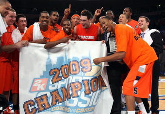NEW YORK - NOVEMBER 20:  The Syracuse Orange celebrate after defeating the North Carolina Tar Heels to win the championship game of the 2K Sports Classic on November 20, 2009 at Madison Square Garden in New York City. The Orange defeated the Tar Heels 87-71 to win the championship.  (Photo by Jim McIsaac/Getty Images)