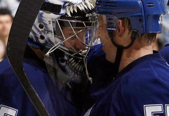 TORONTO - DECEMBER 7:  Vesa Toskala #35 and Jason Blake #55 celebrate 5-2 win during action against the Atlanta Thrashers December 7, 2009 at the Air Canada Centre in Toronto, Ontario, Canada. (Photo by Abelimages/Getty Images)