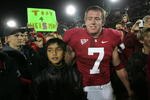 PALO ALTO, CA - NOVEMBER 28:  Toby Gerhart #7 of the Stanford Cardinal is congratulated by fans, with one holding a Toby 4 Heisman sign, after they beat the Notre Dame Fighting Irish at Stanford Stadium on November 28, 2009 in Palo Alto, California.  (Photo by Ezra Shaw/Getty Images)