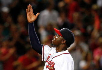 ATLANTA - AUGUST 22:  Closing pitcher Rafael Soriano #39 of the Atlanta Braves celebrates after defeating the Florida Marlins 4-3 on August 22, 2009 at Turner Field in Atlanta, Georgia.  (Photo by Kevin C. Cox/Getty Images)