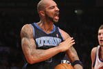 NEW YORK - NOVEMBER 09:  Carlos Boozer #5 of the Utah Jazz celebrates defeating the New York Knicks at Madison Square Garden on November 9, 2009 in New York City. NOTE TO USER: User expressly acknowledges and agrees that, by downloading and or using this photograph, User is consenting to the terms and conditions of the Getty Images License Agreement.  (Photo by Nick Laham/Getty Images)