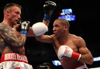 OAKLAND, CA - NOVEMBER 21:  Mikkel Kessler of Denmark (L) is hit by Andre Ward during their WBA Super Middleweight Championship Bout at the Oakland-Alameda County Coliseum on November 21, 2009 in Oakland, California.  (Photo by Jed Jacobsohn/Getty Images)