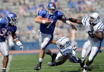 LAWRENCE, KS - SEPTEMBER 19:  Quarterback Kale Pick #7 of the Kansas Jayhawks carries the ball during the game against the Duke Blue Devils on Kivisto Field at Memorial Stadium on September 19, 2009 in Lawrence, Kansas. (Photo by Jamie Squire/Getty Images)