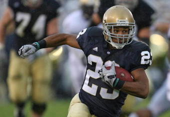 SOUTH BEND, IN - OCTOBER 03: Golden Tate #23 of the Notre Dame Fighting Irish runs against the Washington Huskies on his way to a 67 yard touchdown on October 3, 2009 at Notre Dame Stadium in South Bend, Indiana. (Photo by Jonathan Daniel/Getty Images)