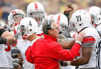 ANN ARBOR, MI - NOVEMBER 21: Head coach Jim Tressel of the Ohio State Buckeyes encourages his players before the game against the Michigan Wolverines on November 21, 2009 at Michigan Stadium in Ann Arbor, Michigan. Ohio State won the game 21-10. (Photo by Gregory Shamus/Getty Images)