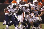 CLEVELAND - DECEMBER 06:  LaDainian Tomlinson #21 of the San Diego Chargers runs the ball through the Cleveland Browns defense at Cleveland Browns Stadium on December 6, 2009 in Cleveland, Ohio.  (Photo by Matt Sullivan/Getty Images)