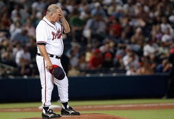 ATLANTA - AUGUST 16: Manager Bobby Cox #6 of the Atlanta Braves stands on the mound and wipes his face while waiting for relief pitcher Manny Acosta #46 to enter the game against the San Francisco Giants on August 16, 2007 at Turner Field in Atlanta, Georgia.  (Photo by Mike Zarrilli/Getty Images)