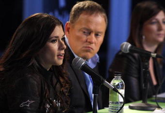 PHOENIX - DECEMBER 08: IndyCar driver Danica Patrick speaks as  (L), Go Daddy CEO Bob Parsons (C) and Vice President and General Manager of JR Motorsports Kelly Earnhardt listen during a press conference announcing Patrick's participation in the 2010 NASCAR season on December 8, 2009 in Phoenix, Arizona. Patrick's first NASCAR race will be February 6th in Daytona, Florida.  (Photo by Joshua Lott/Getty Images)
