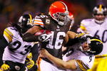 CLEVELAND - DECEMBER 10: Josh Cribbs #16 of the Cleveland Browns stiff-arms Daniel Sepulveda #9 of the Pittsburgh Steelers at Cleveland Browns Stadium on December 10, 2009 in Cleveland, Ohio. (Photo by Gregory Shamus/Getty Images)