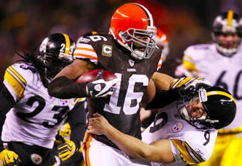 CLEVELAND - DECEMBER 10: Josh Cribbs #16 of the Cleveland Browns stiff-arms Daniel Sepulveda #9 of the Pittsburgh Steelers at Cleveland Browns Stadium on December 10, 2009 in Cleveland, Ohio. (Photo by Gregory Shamus/Getty Images)