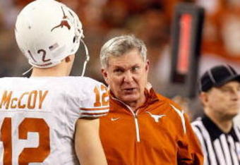 ARLINGTON, TX - DECEMBER 05:  Head coach Mack Brown of the Texas Longhorns talks with Colt McCoy #12 at Cowboys Stadium on December 5, 2009 in Arlington, Texas.  (Photo by Ronald Martinez/Getty Images)