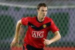 HANGZHOU, CHINA - JULY 26:  Jonny Evans of Manchester United in action during a pre-season friendly match between Hangzhou Greentown and Manchester United as part of the club's Asia Tour 2009 at Huang Long Stadium on July 26, 2009 in Hangzhou, China.  (Photo by Feng Li/Getty Images)
