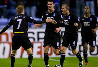 WIGAN, ENGLAND - DECEMBER 5:   Sebastian Larsson (L) of Birmingham celebrates with his team mates after scoring during the Barclays Premier League Match Between Wigan Athletic & Birmingham City at the DW Stadium on December 5, 2009 in Wigan, England (Photo by Gary M. Prior/ Getty Images)
