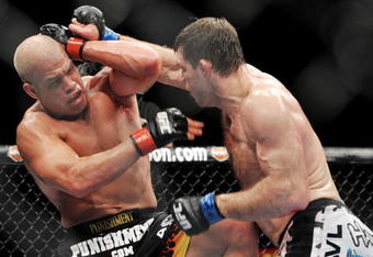 LAS VEGAS - NOVEMBER 21: Tito Ortiz (L) battles Forrest Griffin (R) during their Light Heavyweight Fight at the UFC 106 at Mandalay Bay Events Center on November 21, 2009 in Las Vegas, Nevada. (Photo by Jon Kopaloff/Getty Images)