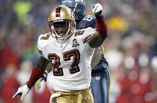 SEATTLE - DECEMBER 14: Walt Harris #27  of the San Francisco 49ers celebrates on the field during the game against the Seattle Seahawks on December 14, 2006 at Qwest Field in Seattle, Washington. (Photo by Otto Greule Jr/Getty Images)