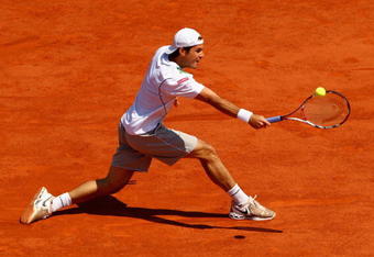 PARIS - JUNE 01:  Tommy Haas of Germany hits a backhand during the Men's Singles Fourth Round match against Roger Federer of Switzerland on day nine of the French Open at Roland Garros on June 1, 2009 in Paris, France.  (Photo by Clive Brunskill/Getty Images)