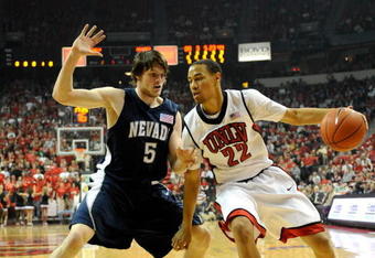 LAS VEGAS - NOVEMBER 18:  Chace Stanback #22 of the UNLV Rebels drives against Luke Babbitt #5 of the Nevada Reno Wolf Pack during their game at the Thomas & Mack Center November 18, 2009 in Las Vegas, Nevada.  (Photo by Ethan Miller/Getty Images)