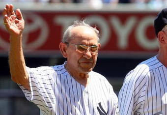 NEW YORK - JULY 19:  New York Yankees Hall of Famer Yogi Berra waves to the crowd during the teams 63rd Old Timers Day before the game against the Detroit Tigers on July 19, 2009 at Yankee Stadium in the Bronx borough of New York City.  (Photo by Jim McIsaac/Getty Images)