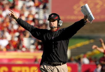 LOS ANGELES, CA - NOVEMBER 14:  Head coach Jim Harbaugh of the Stanford Cardinal signals during the game with the USC Trojans on November 14, 2009 at the Los Angeles Coliseum in Los Angeles, California.  Stanford won 55-21.  (Photo by Stephen Dunn/Getty Images)