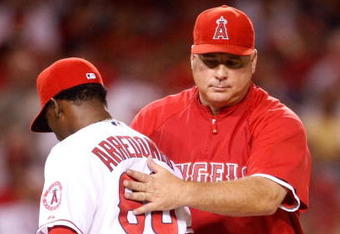 ANAHEIM, CA - AUGUST 29:  Relief pitcher Jose Arredondo #66 of the Los Angeles Angels of Anaheim is taken out of the game in the seventh inning by manager Mike Scioscia during the game against the Oakland Athletics at Angel Stadium on August 29, 2009 in Anaheim, California. The Athletics defeated the Angels 4-3.  (Photo by Jeff Gross/Getty Images)