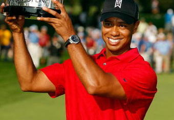 GRAND BLANC, MI - AUGUST 02:  Tiger Woods holds up the trophy after winning the final round of the Buick Open at Warwick Hills Golf and Country Club on August 2, 2009 in Grand Blanc, Michigan.  Woods won the tournament with a total of 20 under par.  (Photo by Chris Graythen/Getty Images)